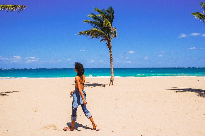 A woman walking on the beach in Puerto Rico