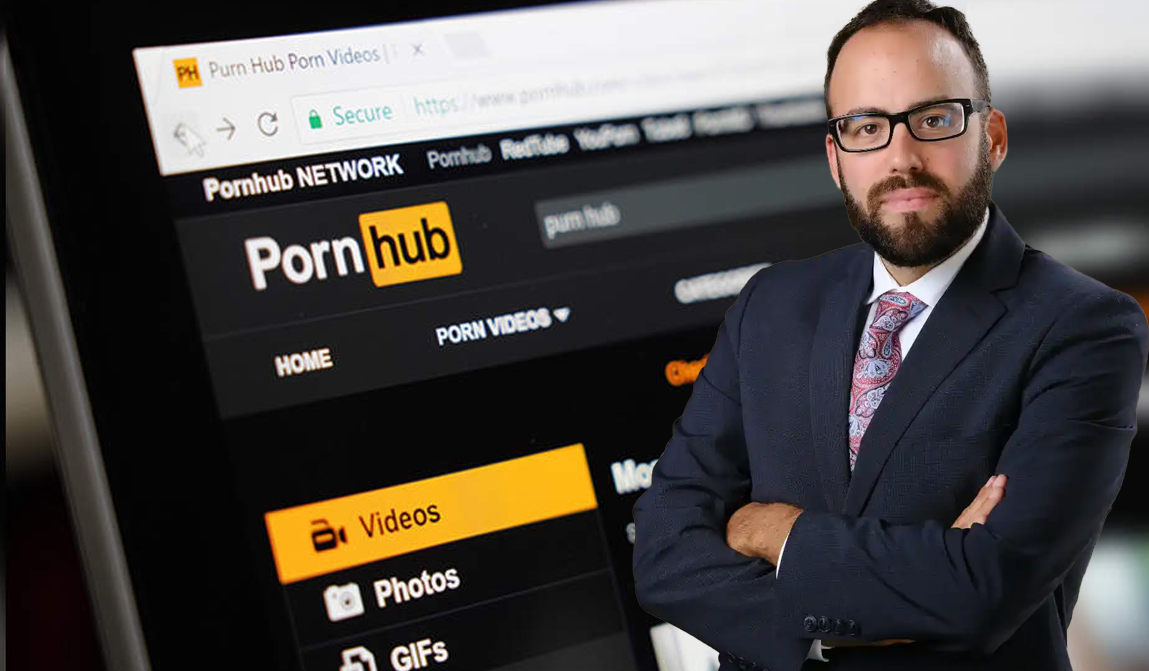 A man next to Pornhub website