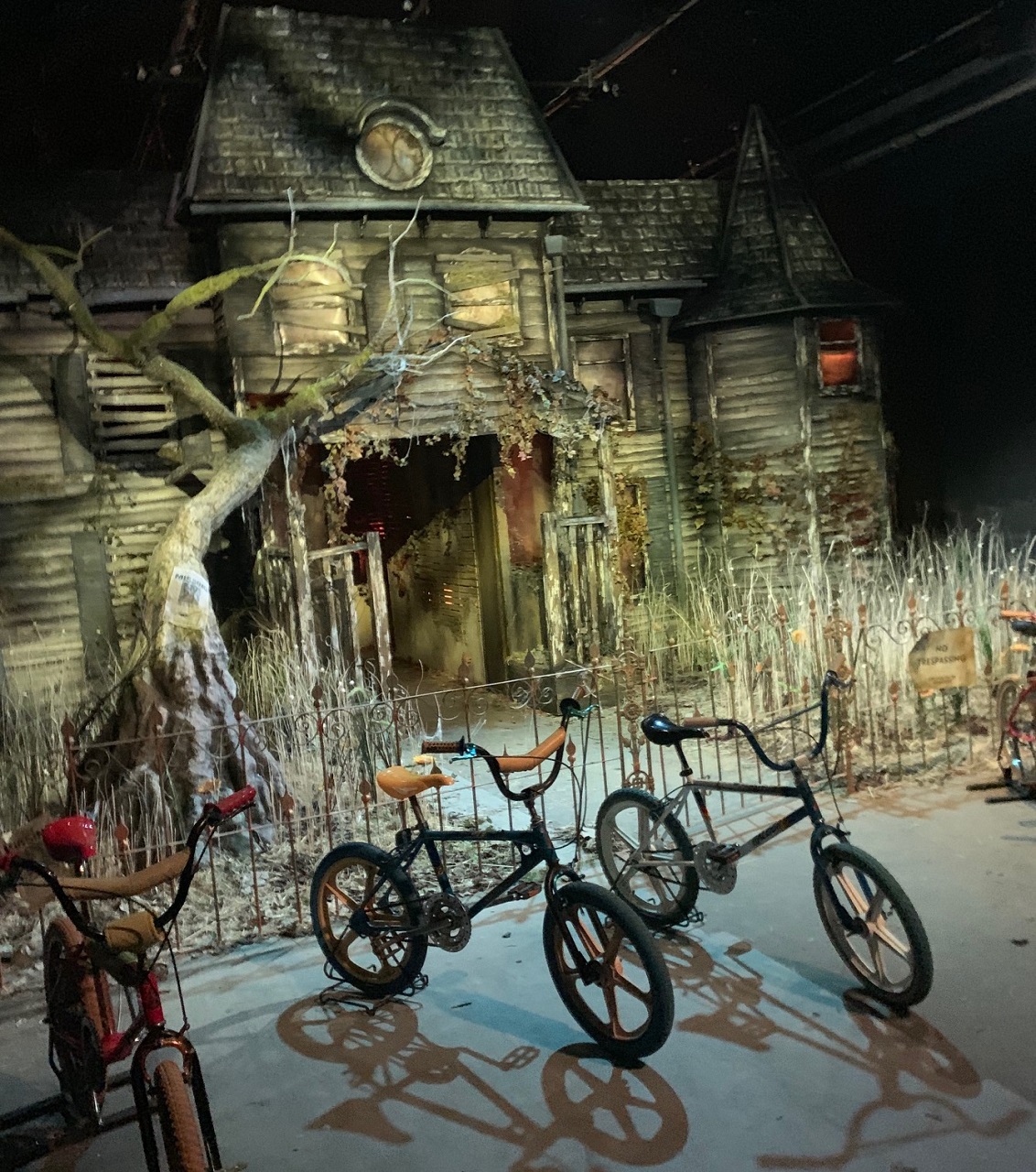 A replica of the house of Pennywise, with four teen’s bicycles parked outside at the Fun House in London