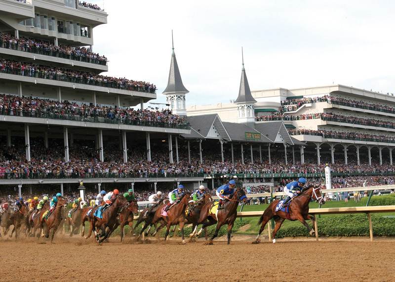 Horses are running during horse racing.