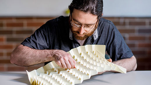 A man working on origami