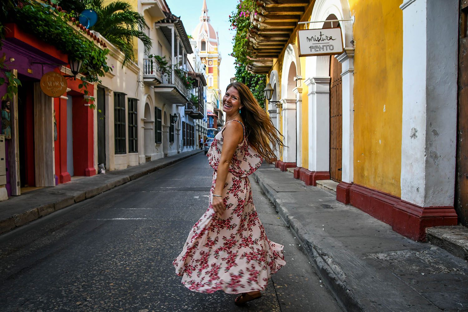A woman wearing a floral dress