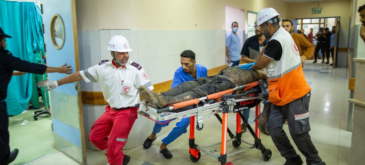 Gaza medics rushing injured to operation room