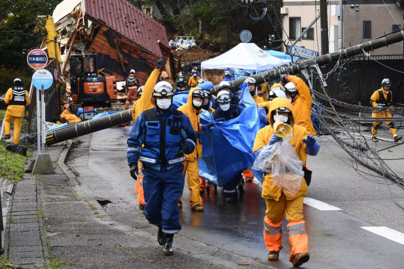 Japan officials rescuing people