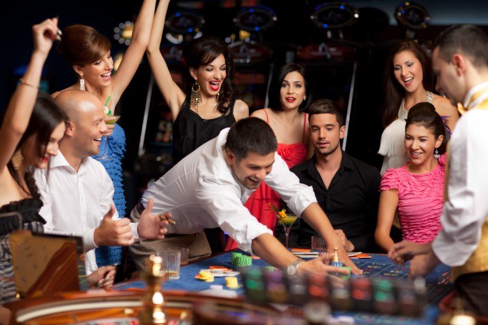 Group of people gambling at a casino